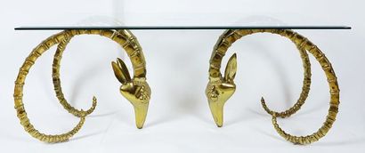 null Coffee table, brass base formed by two heads of antelopes or rams. The redctangular...