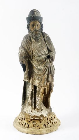 null 16th Century statue in carved and polychrome stone; 

it rests on a posterior...