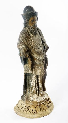 null 16th Century statue in carved and polychrome stone; 

it rests on a posterior...