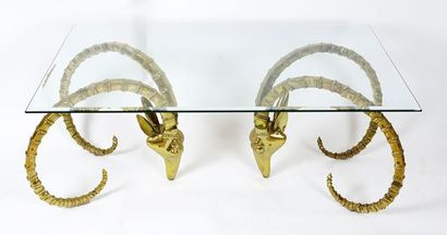Coffee table, brass base formed by two heads...