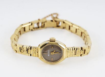 null Lady's BULOVA watch, gold metal oval case, brown dial with baton indexes, gold...