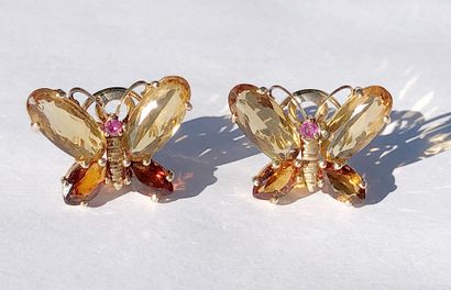 null 14K GOLD TOPAZ

Pair of 14K yellow gold butterfly-shaped clip-on earrings adorned...
