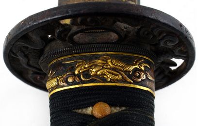 null SABRE JAPONAIS / JAPANESE SWORD

A japanese sword with a lacquered wood scabbard.

Japan,...
