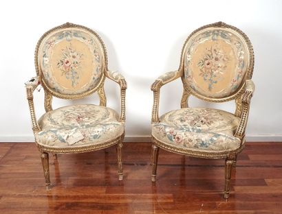 Pair of armchairs with gilded wood medallion...
