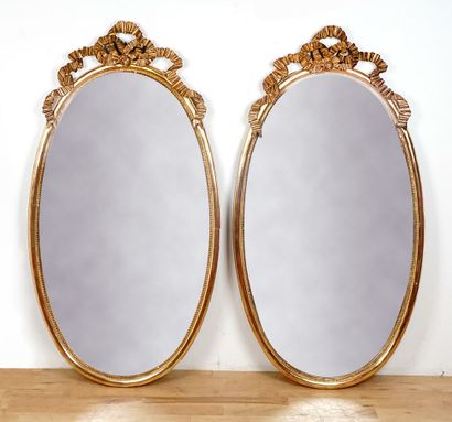 Pair of Louis XVI style oval mirrors in wood...