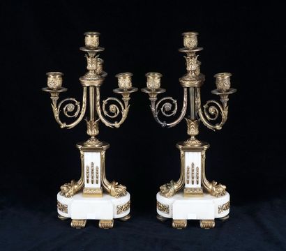 null Pair of gilt bronze and white marble candelabras, with four sconces, Louis XVI...