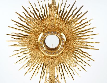 null Monstrance in gilded metal, rests on a tripod baluster foot. In its original...