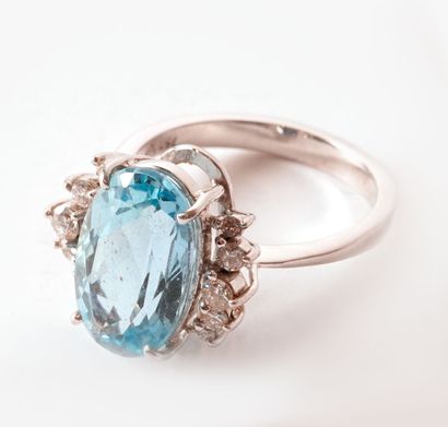 null 18K GOLD AGUAMARINE
18K white gold ring set with an aquamarine and diamonds.
Gross...