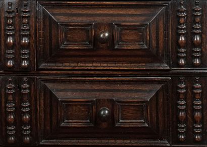 null English Jacobean style chest of drawers. The uprights are carved, as are the...