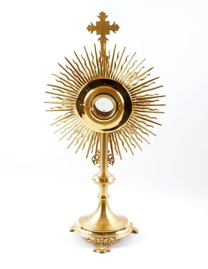 null Monstrance in gilded metal, rests on a tripod baluster foot. In its original...