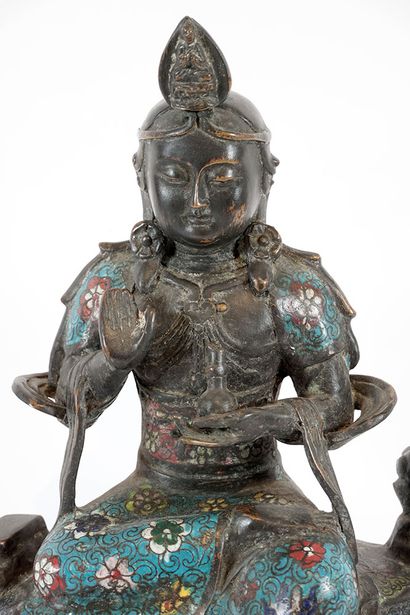 null MANJUSHRI 





A copper champlevés seated figure of Manjushri. 





Height...