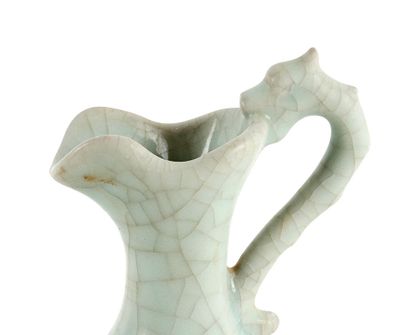 null CHINE / CHINA 

A white glazed Dragon handle wine ewer. 

Height : 25.5cm or...