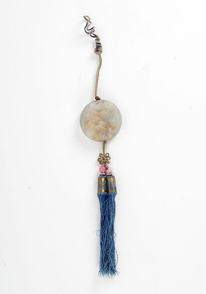 JADE

A white jade plaque with a tassel....