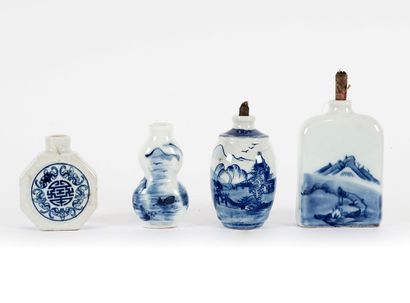 null CHINE / CHINA 

A collection of four blue and white medicine bottles with royal...