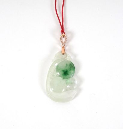 JADE

A green jadeite pendant. 20th century....