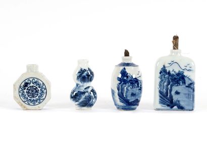 null CHINE / CHINA 

A collection of four blue and white medicine bottles with royal...