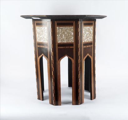 null Octagonal wooden pedestal table inlaid with mother-of-pearl and decorated with...
