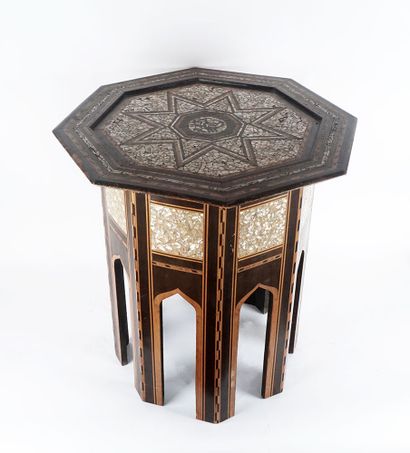 null Octagonal wooden pedestal table inlaid with mother-of-pearl and decorated with...