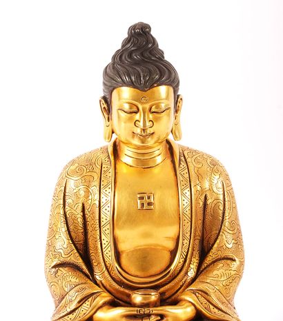 null SHAKYAMUNI 

Figure assise de Shakyamuni en cuivre doré. Marque du règne de...