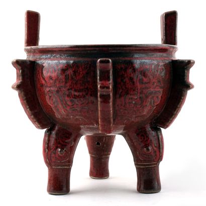 null PORCELAIN / PORCELAIN
A tripod ritual vessel with red glaze. Hsüan-te mark,...
