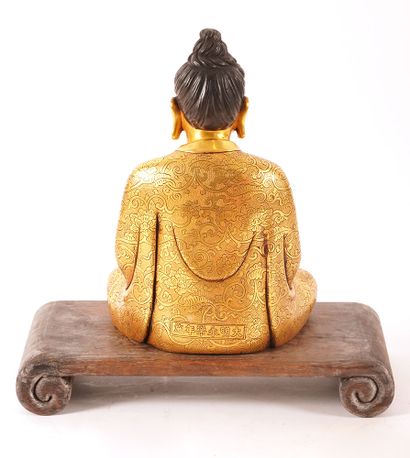 null SHAKYAMUNI 

Figure assise de Shakyamuni en cuivre doré. Marque du règne de...