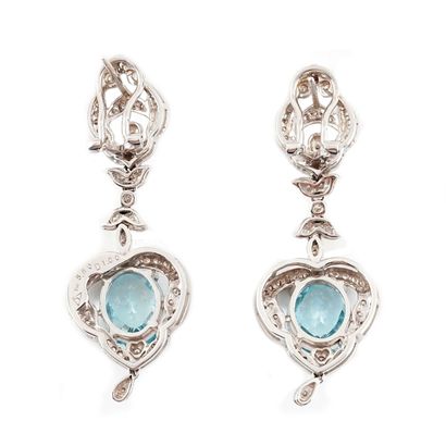 null 18K GOLD AGUAMARINE
Pair of dangling earrings set with aquamarines totaling...