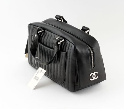 null CHANEL 
Black camera bag by Chanel. 
Width: 31cm - 12 1/4"
Height: 20cm - 7...