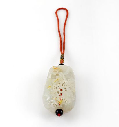 CHINA

Finely carved pendant in white jade...
