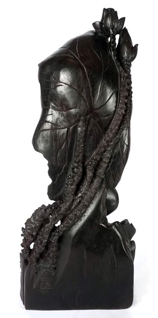 null CHINA

Statuette in black lacquered wood, representing Guanyin standing on a...