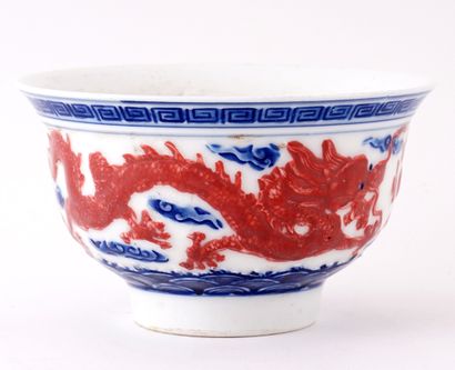 null CHINA

White porcelain cup, with blue and coral enameled decoration of a dragon...