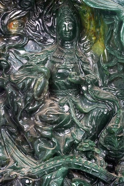 null CHINA

Malachite group, with sculpted decoration of the goddess Guanyin seated...
