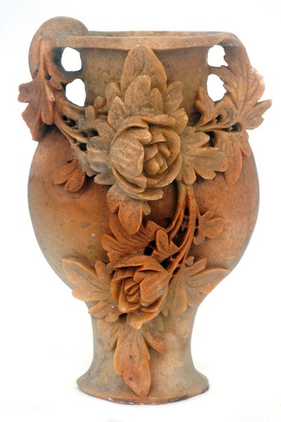 null CHINA

Orange soapstone vase, with relief decoration of peony flowers. Mid-20th...