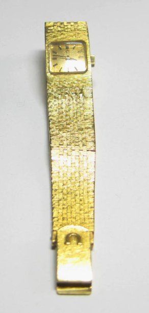 OMÉGA Montre en or jaune 18kt, bracelet souple, cadran carré et index bâton. Poids:...