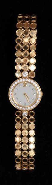 HARRY WINSTON Bracelet montre en or jaune, la lunette et les index sertis de diamants,...