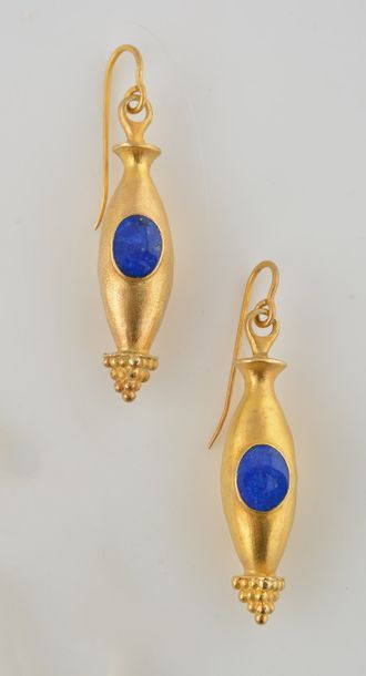 Goudji Pair of gilded silver earrings, each adorned with a lapis lazuli cabochon....