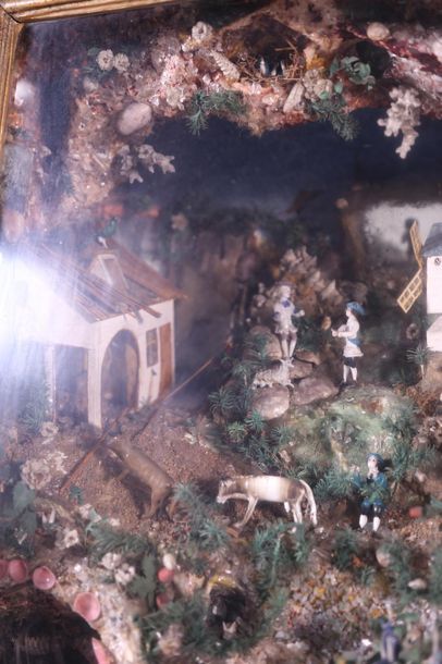 null Boîte vitrine contenant un diorama représentant un paysage animé de personnages...