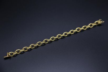 null Bracelet à maillons stylisés en or jaune 750 millièmes - Orfèvre : JP et as...