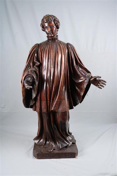null Saint Louis de Gonzague en bois sculpté en ronde-bosse. Debout, il est vêtu...