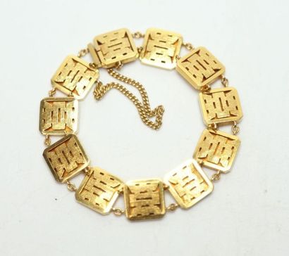 null Bracelet en or jaune à onze maillons carrés stylisés Extrême Orient, avec chaînette...