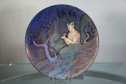 null Jean BAROL (1873-1966), plat en grès vernissé à décor d'un faune jouant de la...