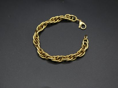 null Bracelet en or jaune 750 millièmes, à maillons entrelacés stylisant une corde...