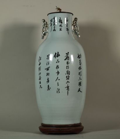 null Baluster vase decorated with flowers, fruits and ideograms, mounted on a base.

H....