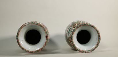 null A pair of Canton porcelain vases of baluster form with reserve decoration of...