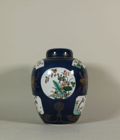 null A blue porcelain ginger pot with flowers in reserve on a blue background and...