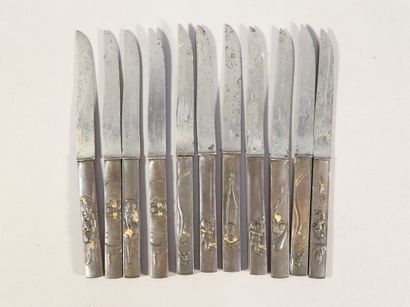 null Eleven steel blade knives, mounted on bronze kozuka handles.