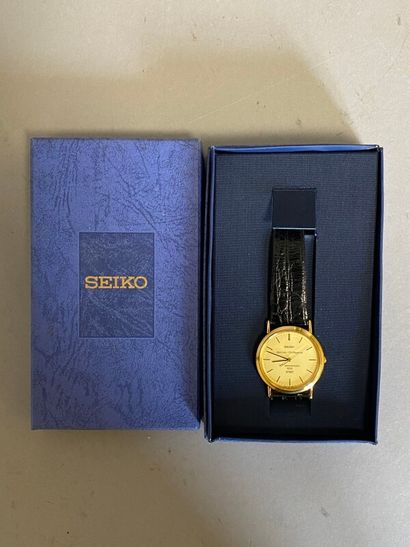 null SEIKO, montre bracelet boitier métal doré modèle Spirit marqué 10e anniversaire...