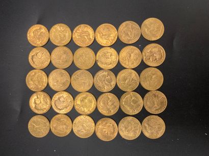 null * Trente pièces de 20 francs or - Coq - Poids : 193,79 g