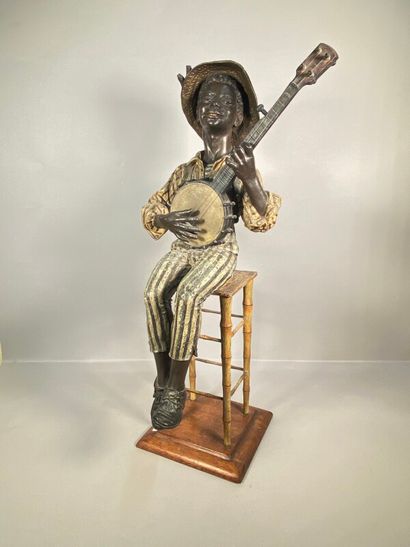 null Goldscheider, dans le goût de,

Jeune homme au chapeau jouant du banjo assis...