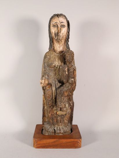 null Vierge à l'enfant 

sujet en bois sculpté polychrome

H. 51 cm 

sur un socle...