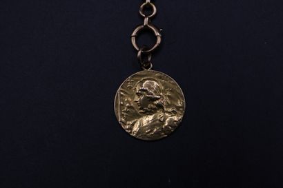 null Element of chatelaine holding a medal with the effigy of Joan of Arc in yellow...